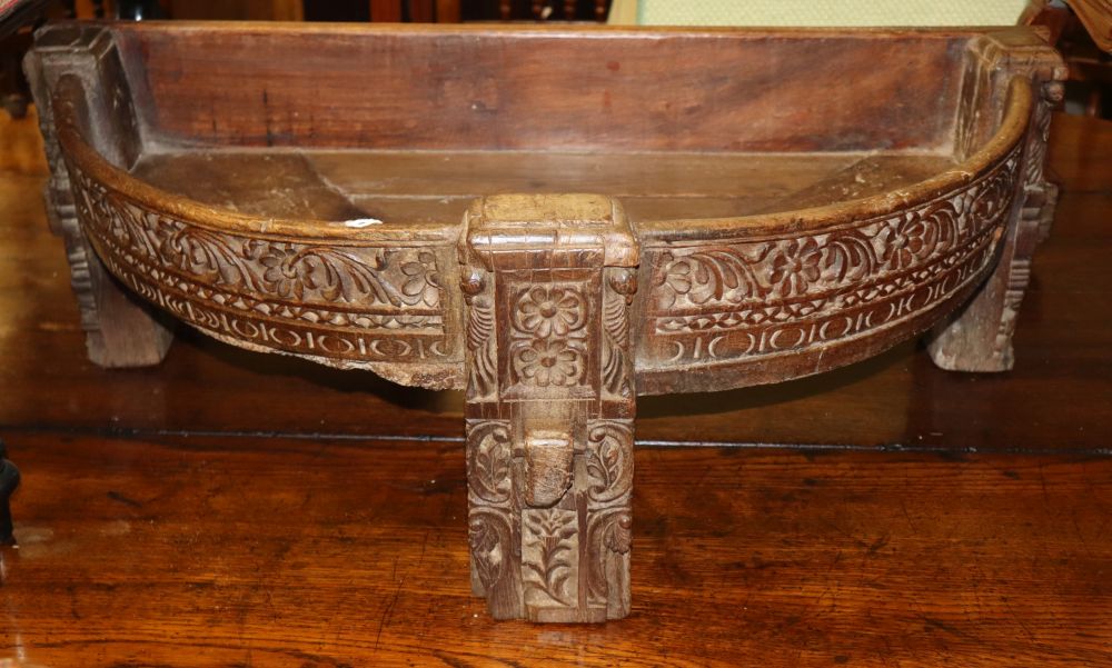 An Indian carved hardwood D shaped planter, W.84cm, D.44cm, H.29cm